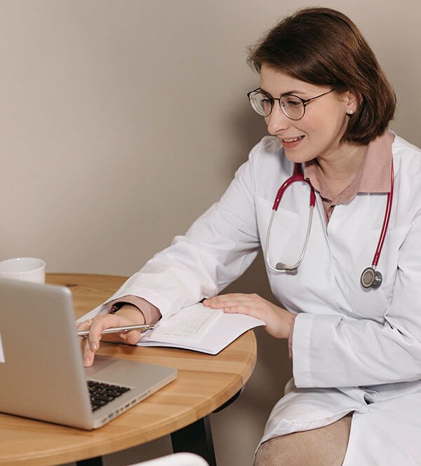 physician using a laptop